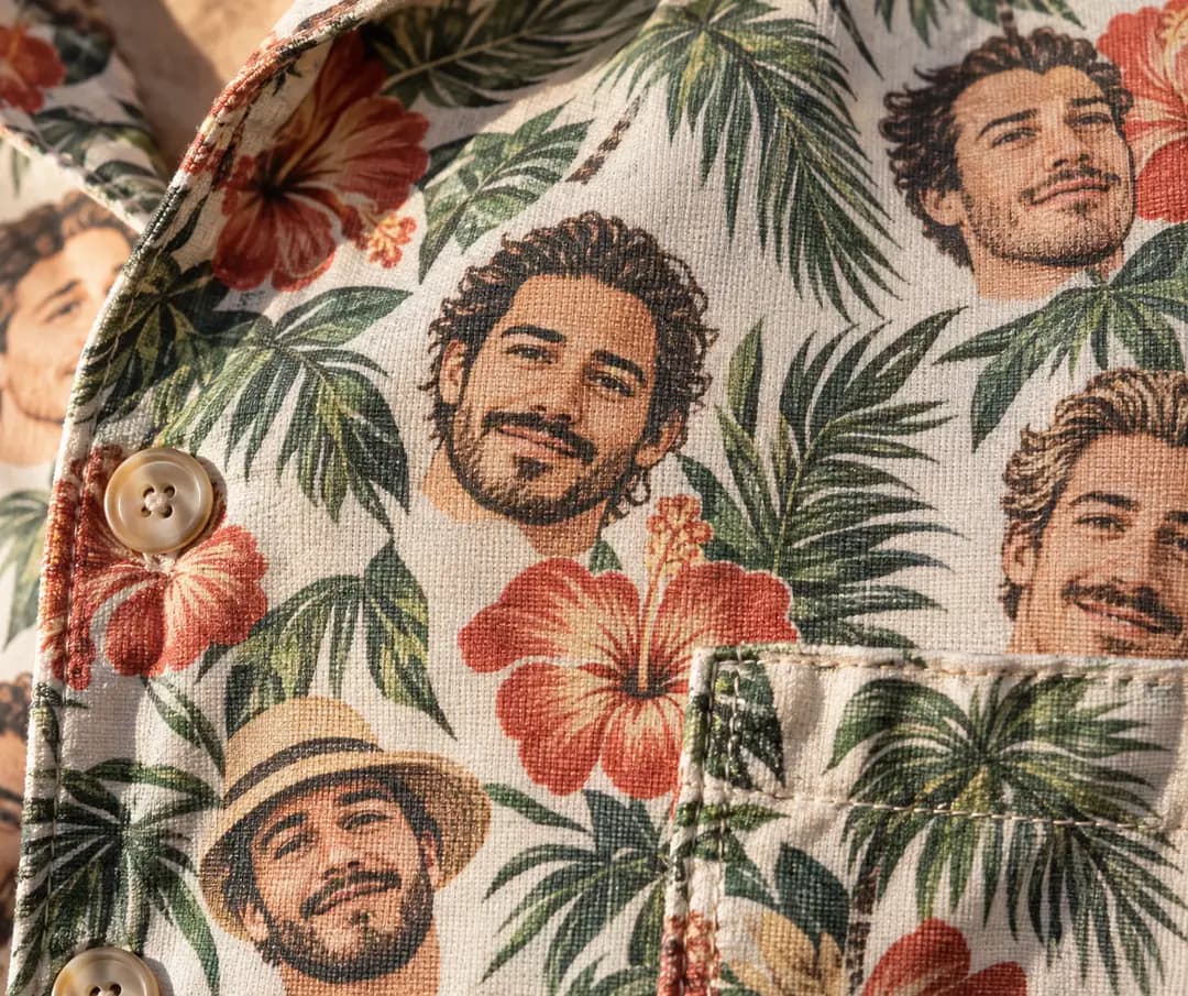 Illustrated tropical fabric with one fictional face repeated among hibiscus flowers