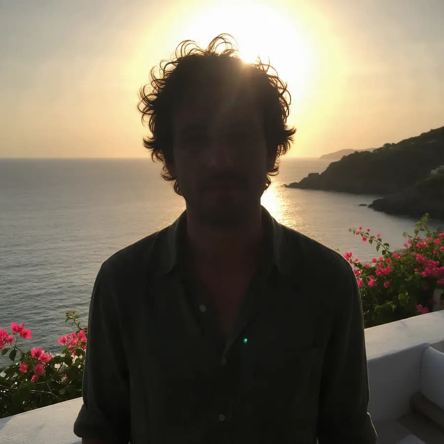 Adult man photographed against a low sun, his face in dark shadow